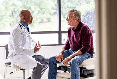 Doctor speaking to patient with LR-MDS anemia about REBLOZYL